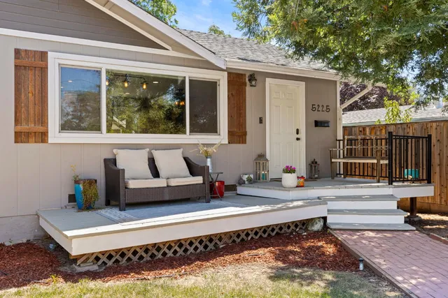 a building outdoor space with patio furniture and potted plants