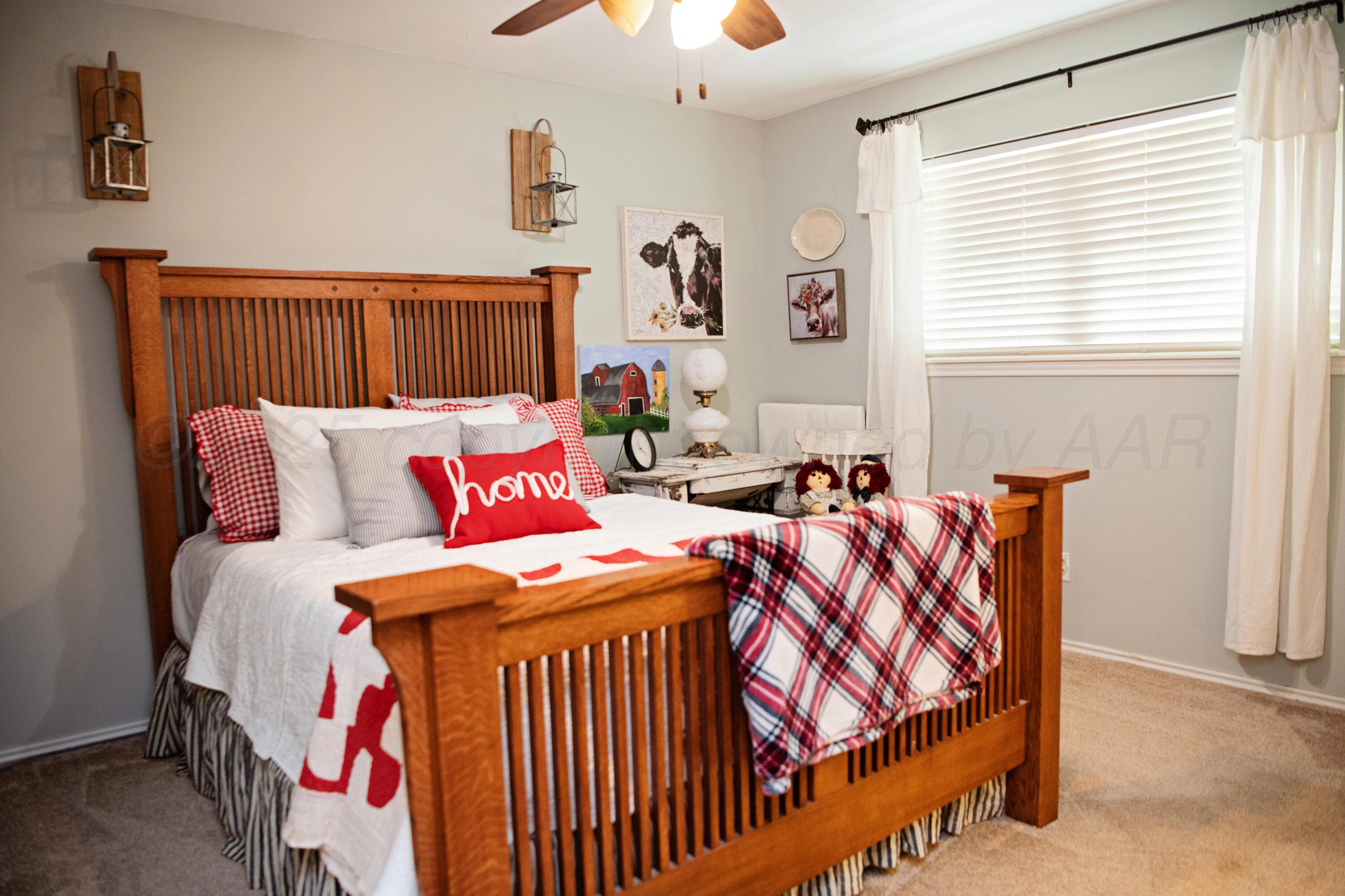 307 Douglas Street Hereford, TX 79045 - Photo 11 of 15 a bedroom with a bed and a window