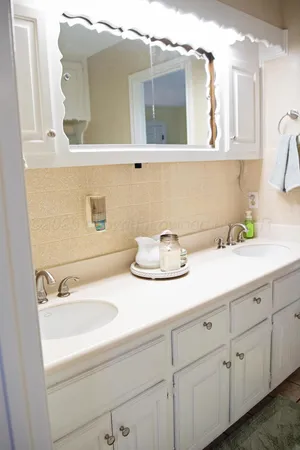 a bathroom with a sink and a mirror
