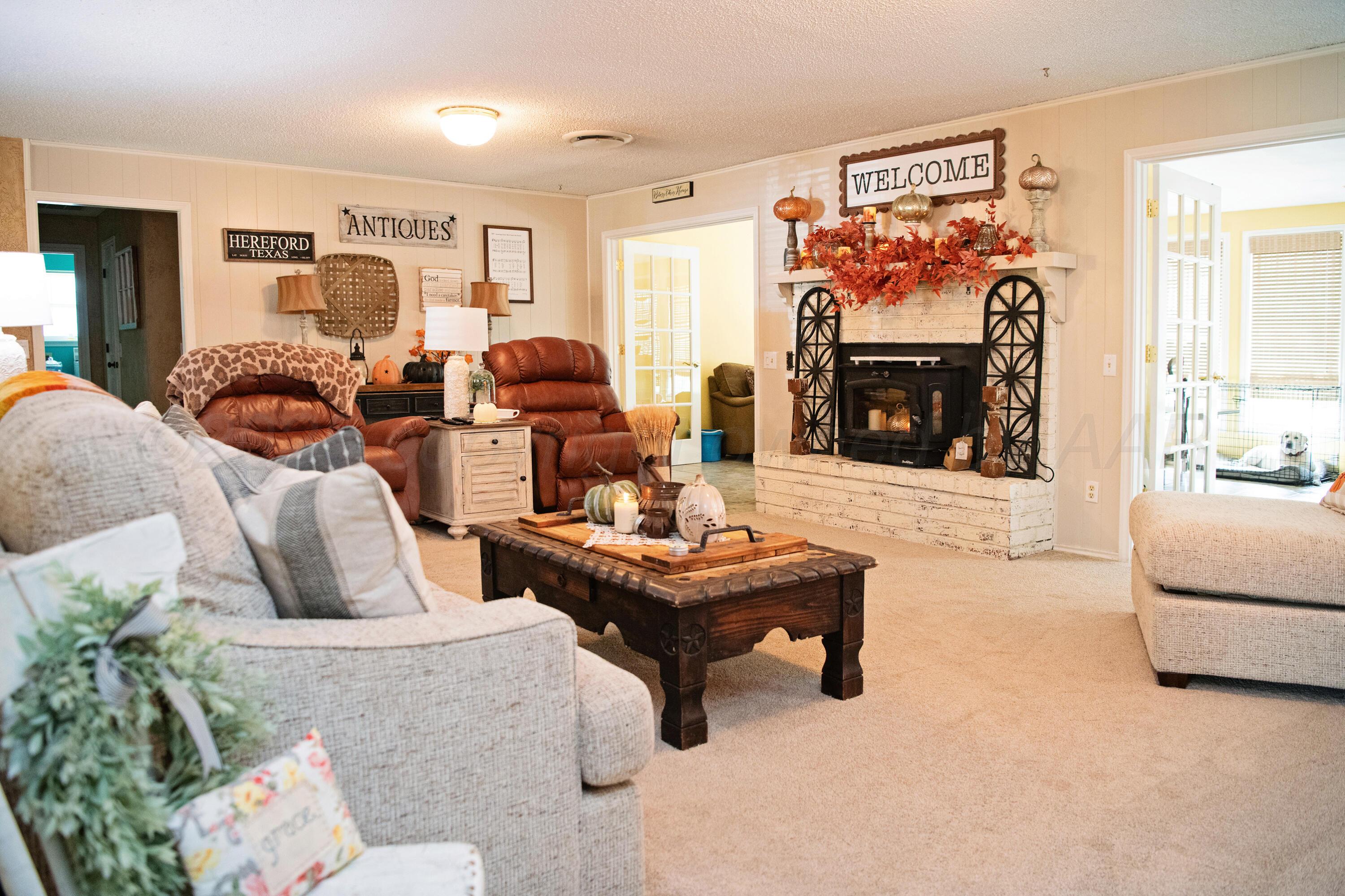 307 Douglas Street Hereford, TX 79045 - Photo 4 of 15 a living room with furniture and a fireplace
