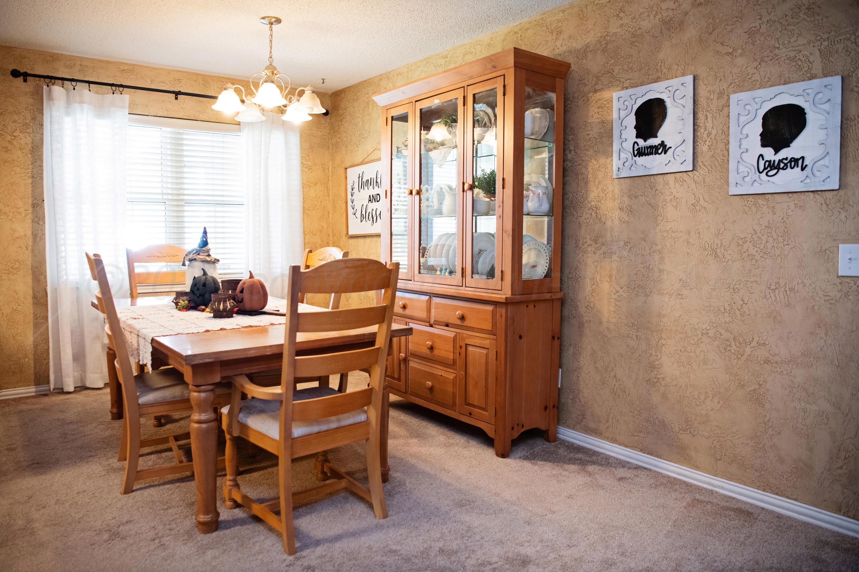 307 Douglas Street Hereford, TX 79045 - Photo 5 of 15 a dining room with furniture and window