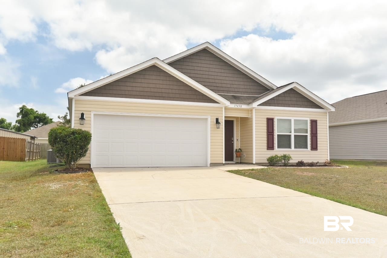 17430 Harding Drive Foley, AL 36535 - Photo 2 of 37 Craftsman house featuring a front lawn, a garage, fence, and concrete driveway