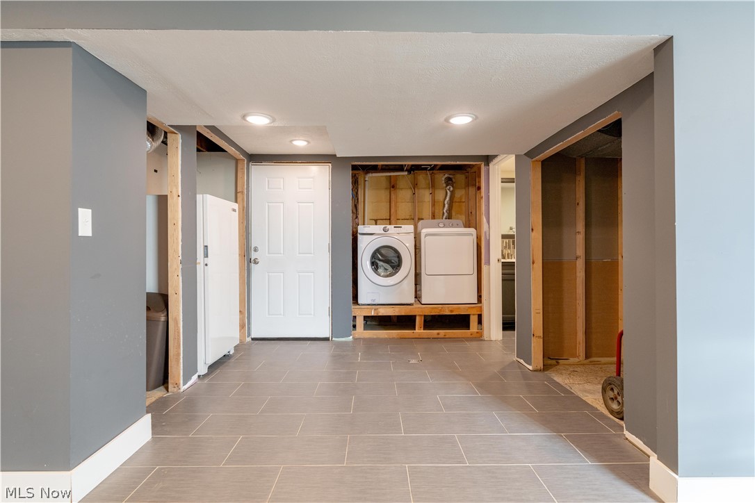 6116 Melody Road Northeast Canton, OH 44721 - Photo 27 of 33 Laundry area featuring washer and dryer, recessed lighting, and light tile patterned flooring