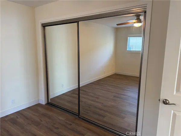 a bathroom with a sink shower and a mirror