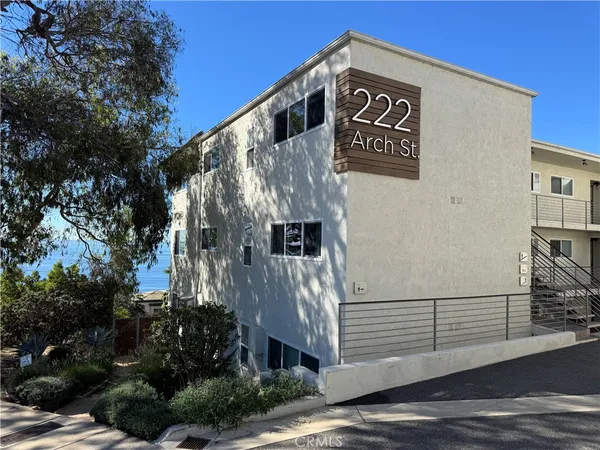 a backyard of a house with outdoor seating