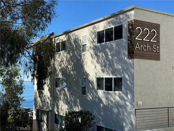 a living room with furniture and flowers