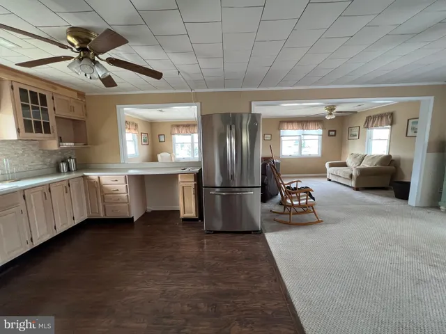a kitchen with sink cabinets and window