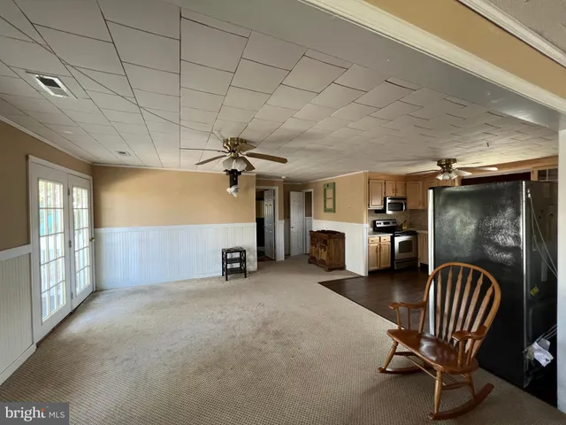 a bedroom with two beds and a window