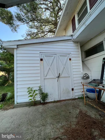a view of a house with wooden fence