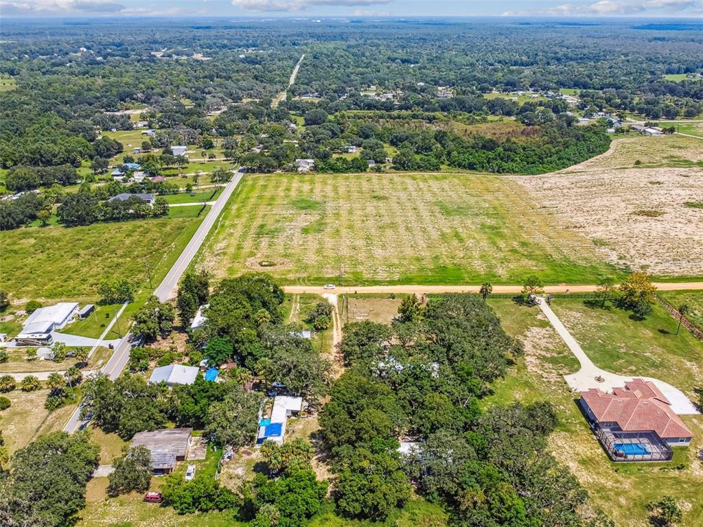 1101 Bird Road Davenport, FL 33837 - Photo 12 of 36 an aerial view of residential houses with outdoor space
