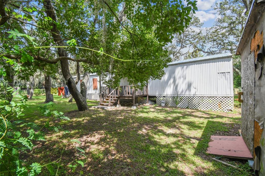 1101 Bird Road Davenport, FL 33837 - Photo 29 of 36 a backyard of a house with lots of green space