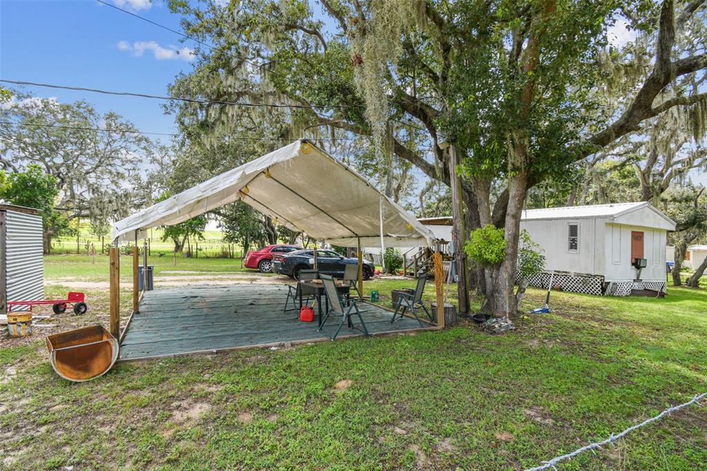 1101 Bird Road Davenport, FL 33837 - Photo 34 of 36 a view of a house with a backyard and sitting area