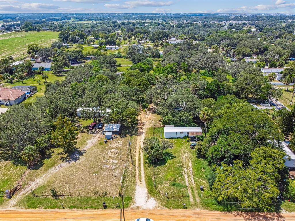 1101 Bird Road Davenport, FL 33837 - Photo 5 of 36 an aerial view of a residential houses with outdoor space and trees