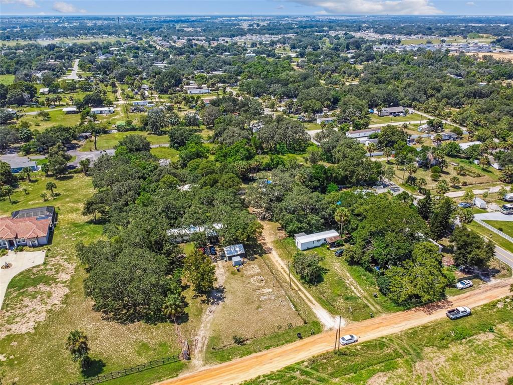 1101 Bird Road Davenport, FL 33837 - Photo 7 of 36 an aerial view of residential houses with outdoor space