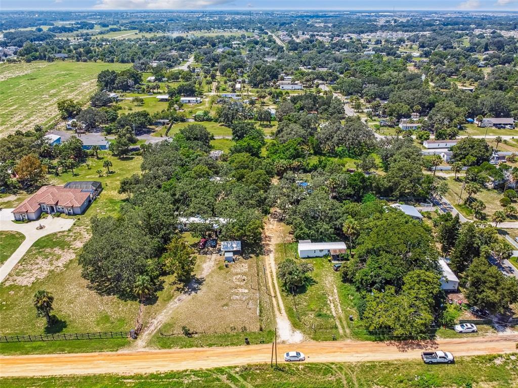 1101 Bird Road Davenport, FL 33837 - Photo 8 of 36 an aerial view of residential houses with outdoor space