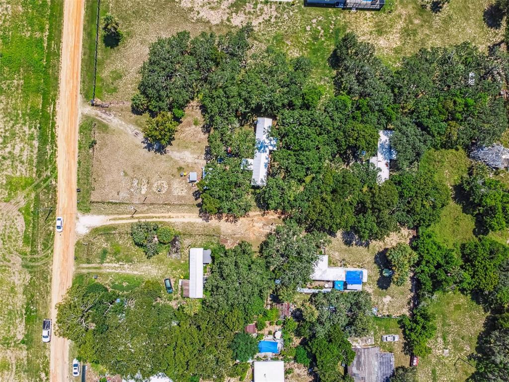 1101 Bird Road Davenport, FL 33837 - Photo 10 of 36 an aerial view of residential houses with trees