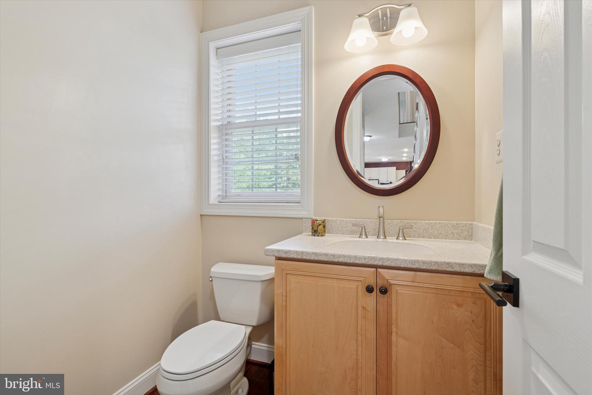 1375 Sloan Way Ambler, PA 19002 - Photo 25 of 54 a bathroom with a toilet sink vanity and mirror