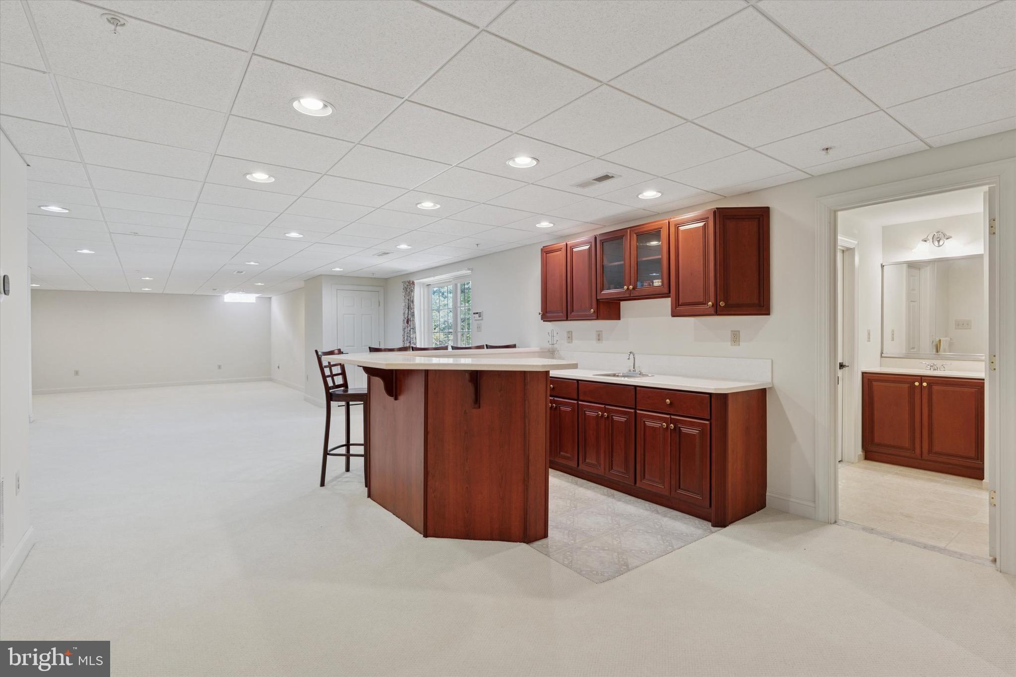 1375 Sloan Way Ambler, PA 19002 - Photo 26 of 54 a large room with kitchen island a sink stainless steel appliances and cabinets