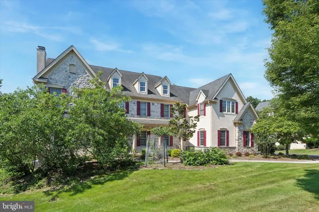 a view of a brick building next to a yard