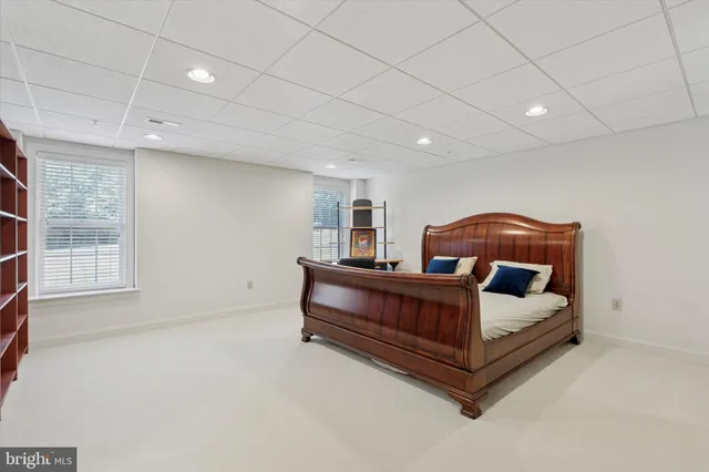 a view of staircase with wooden floor and a rug
