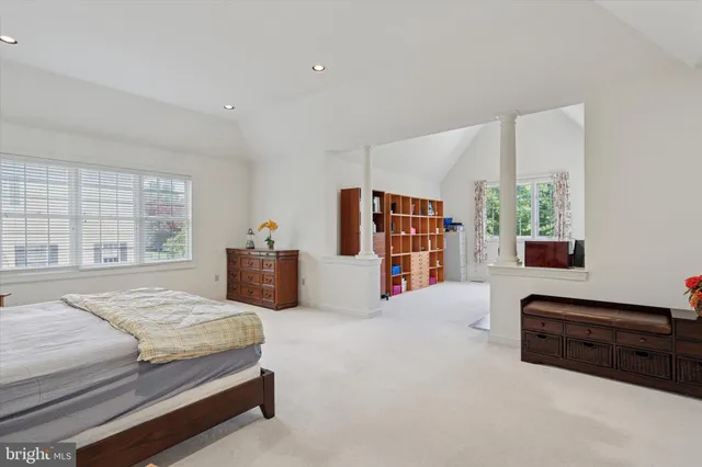 a view of a bathroom with sink mirror and window