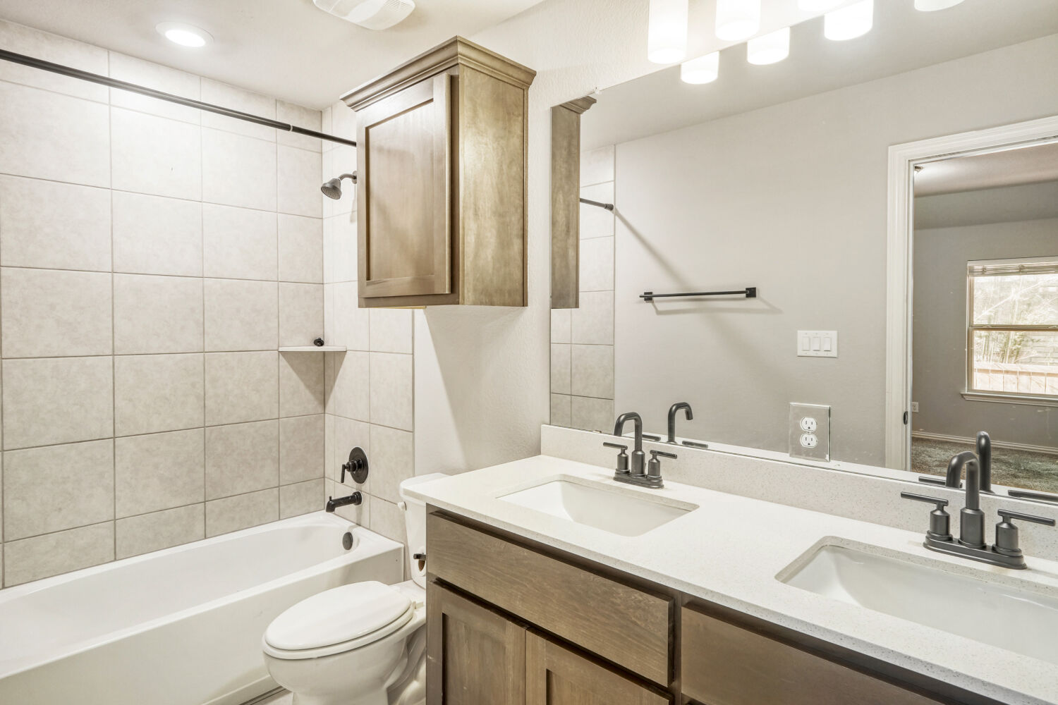 426 Cold Riv Run Kyle, TX 78640 - Photo 16 of 24 Bathroom with double vanity and washtub / shower combination