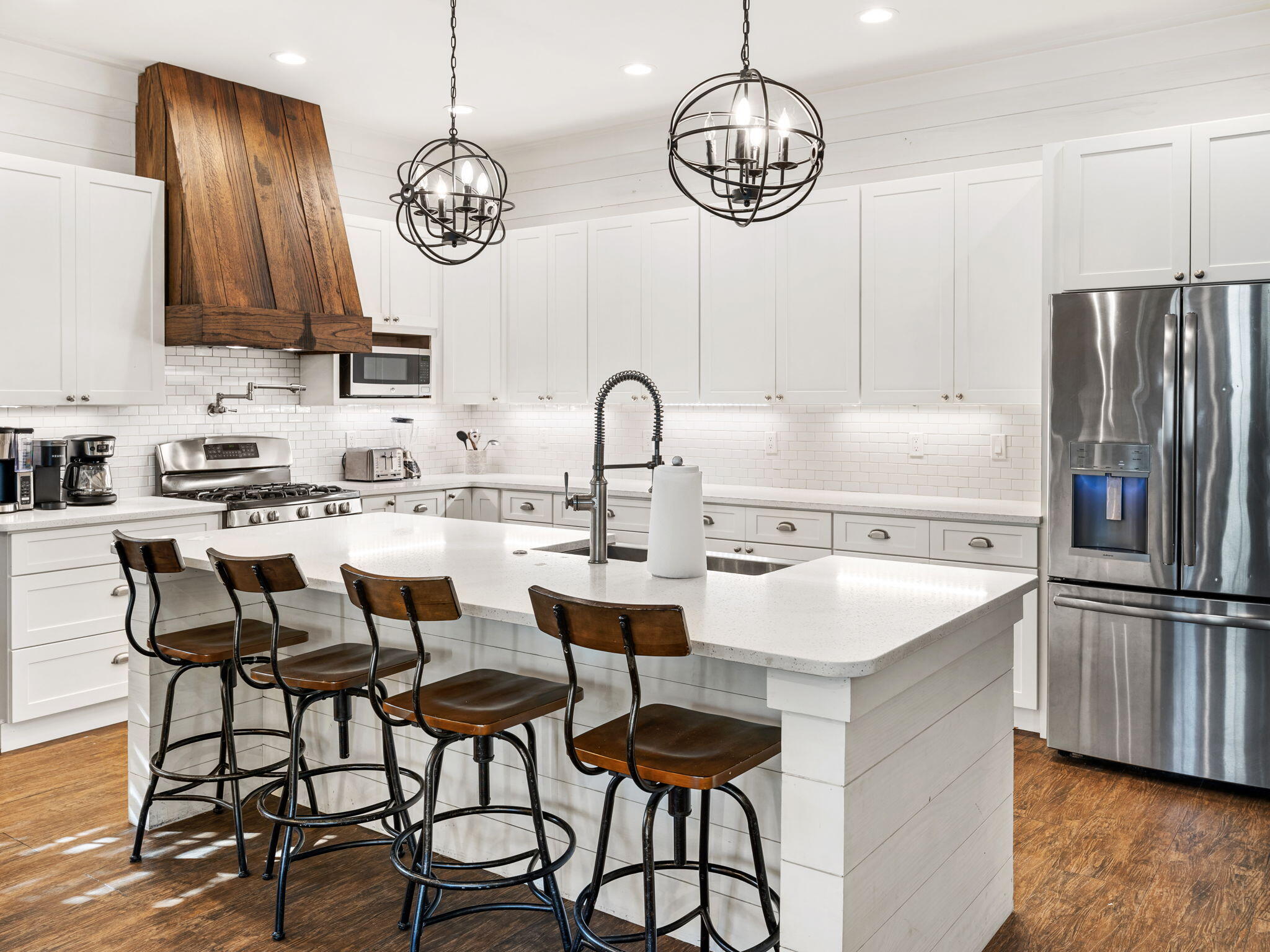 9 Willow Mist Road Inlet Beach, FL 32461 - Photo 8 of 52 a kitchen with stainless steel appliances a table chairs and a refrigerator