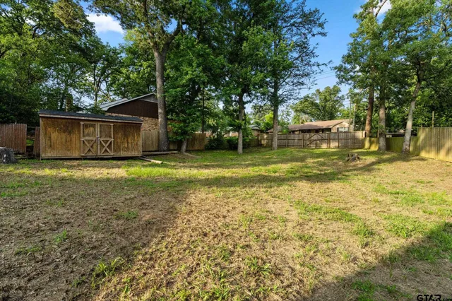 a backyard of a house with lots of green space