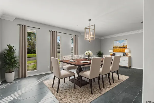 a view of a dining room with furniture and window