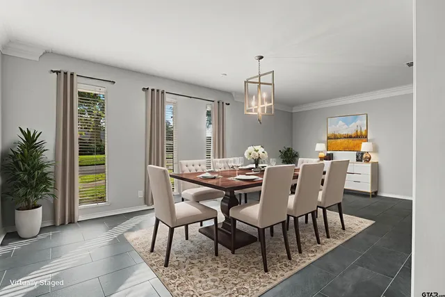 a view of a dining room with furniture and window