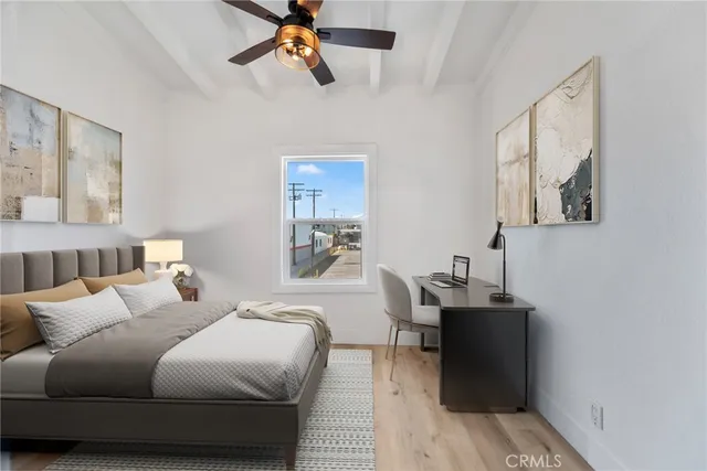 a bedroom with furniture and a window