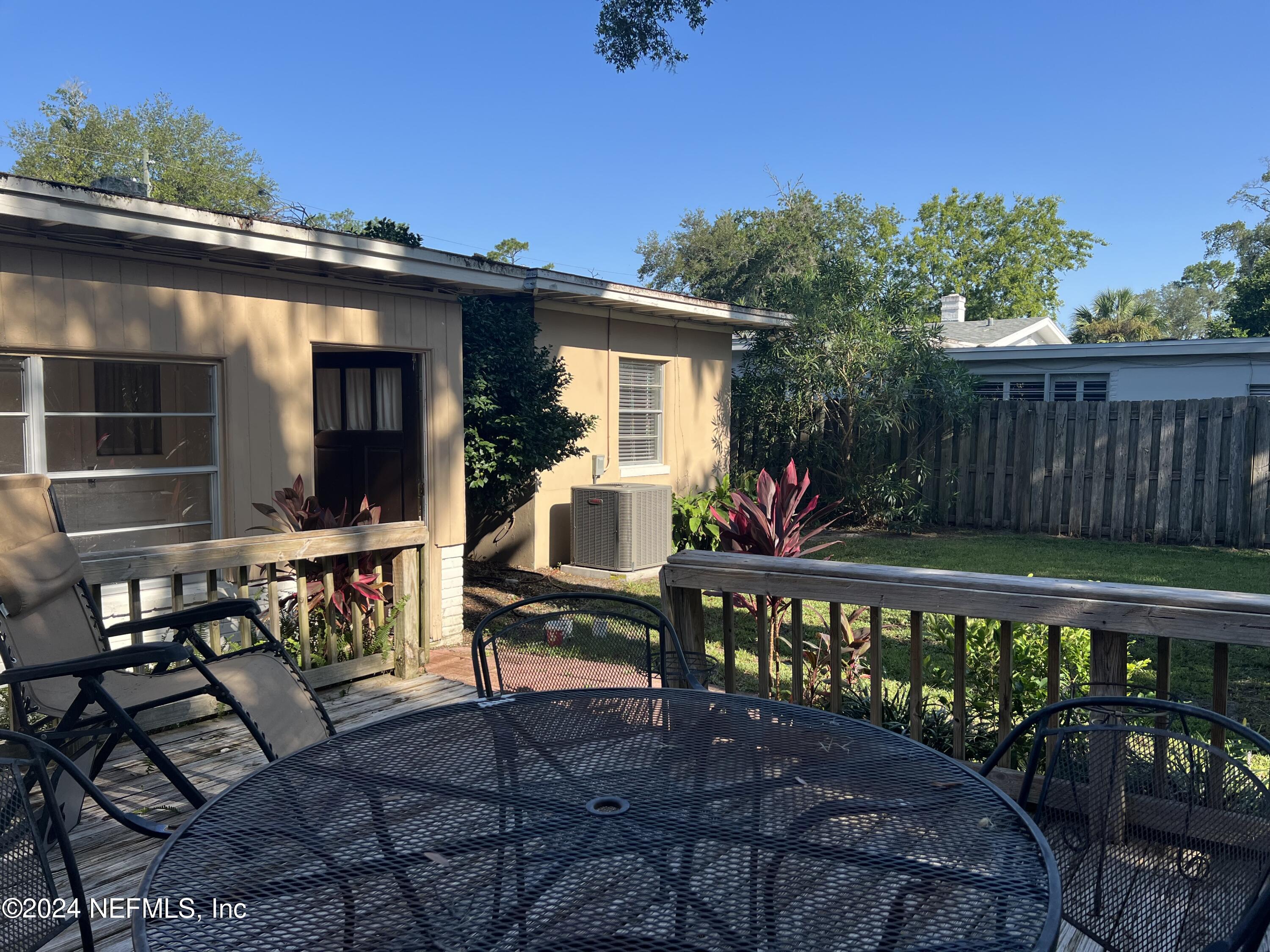 6115 Stetson Road Jacksonville, FL 32217 - Photo 12 of 25 a view of a wooden bench with a bench in patio