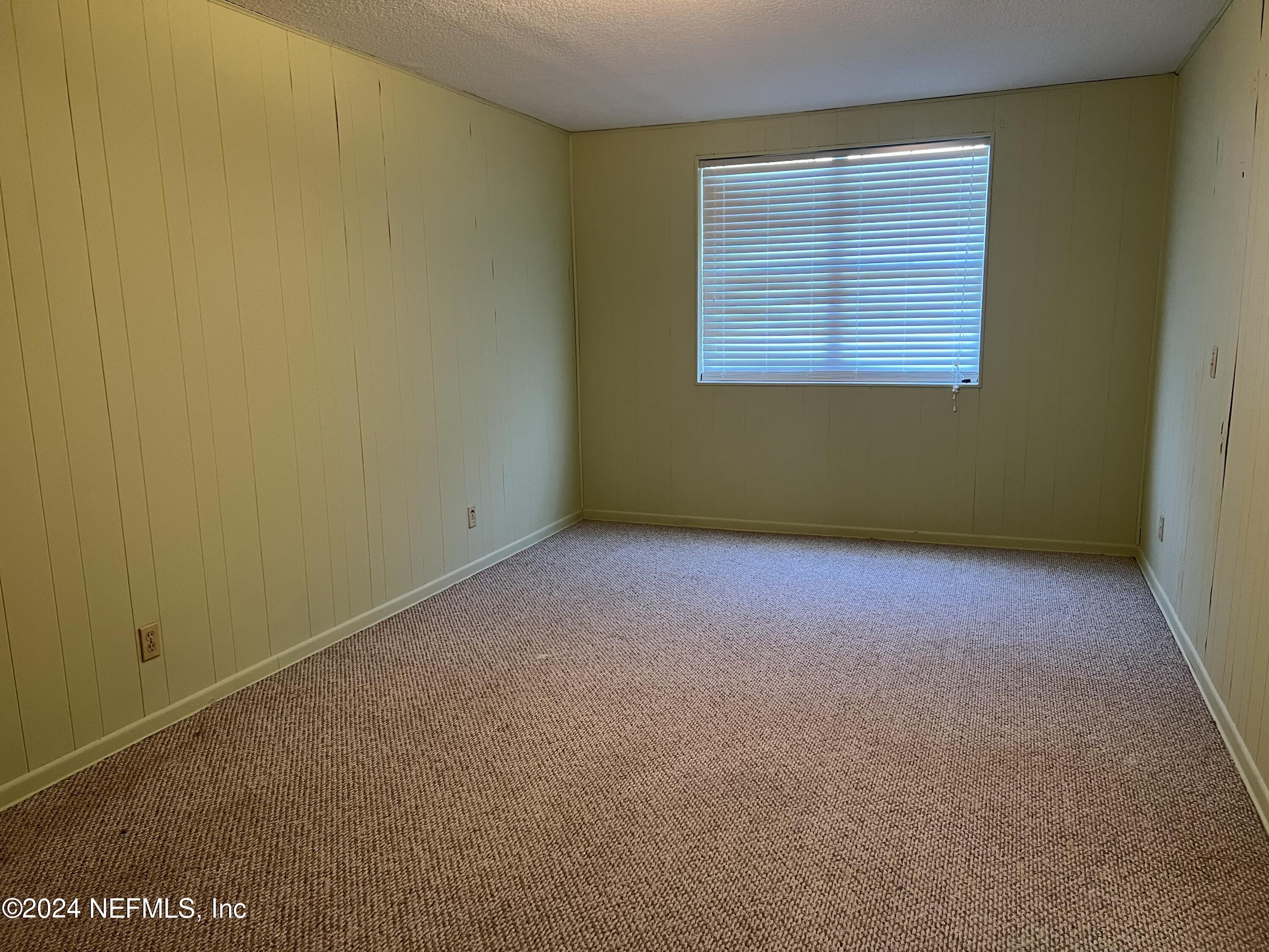 6115 Stetson Road Jacksonville, FL 32217 - Photo 20 of 25 an empty room with a window
