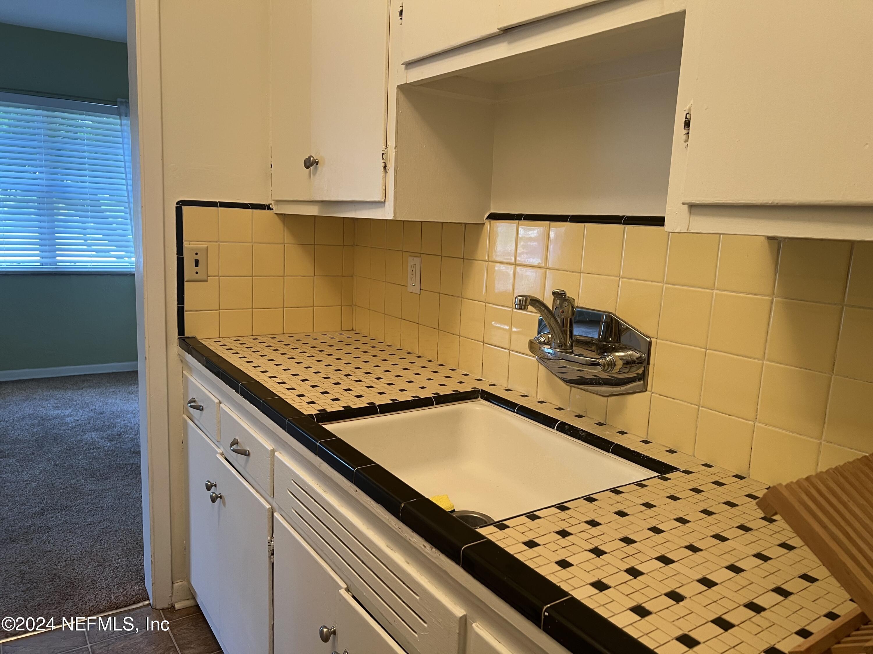 6115 Stetson Road Jacksonville, FL 32217 - Photo 3 of 25 a kitchen with a stove and a cabinets