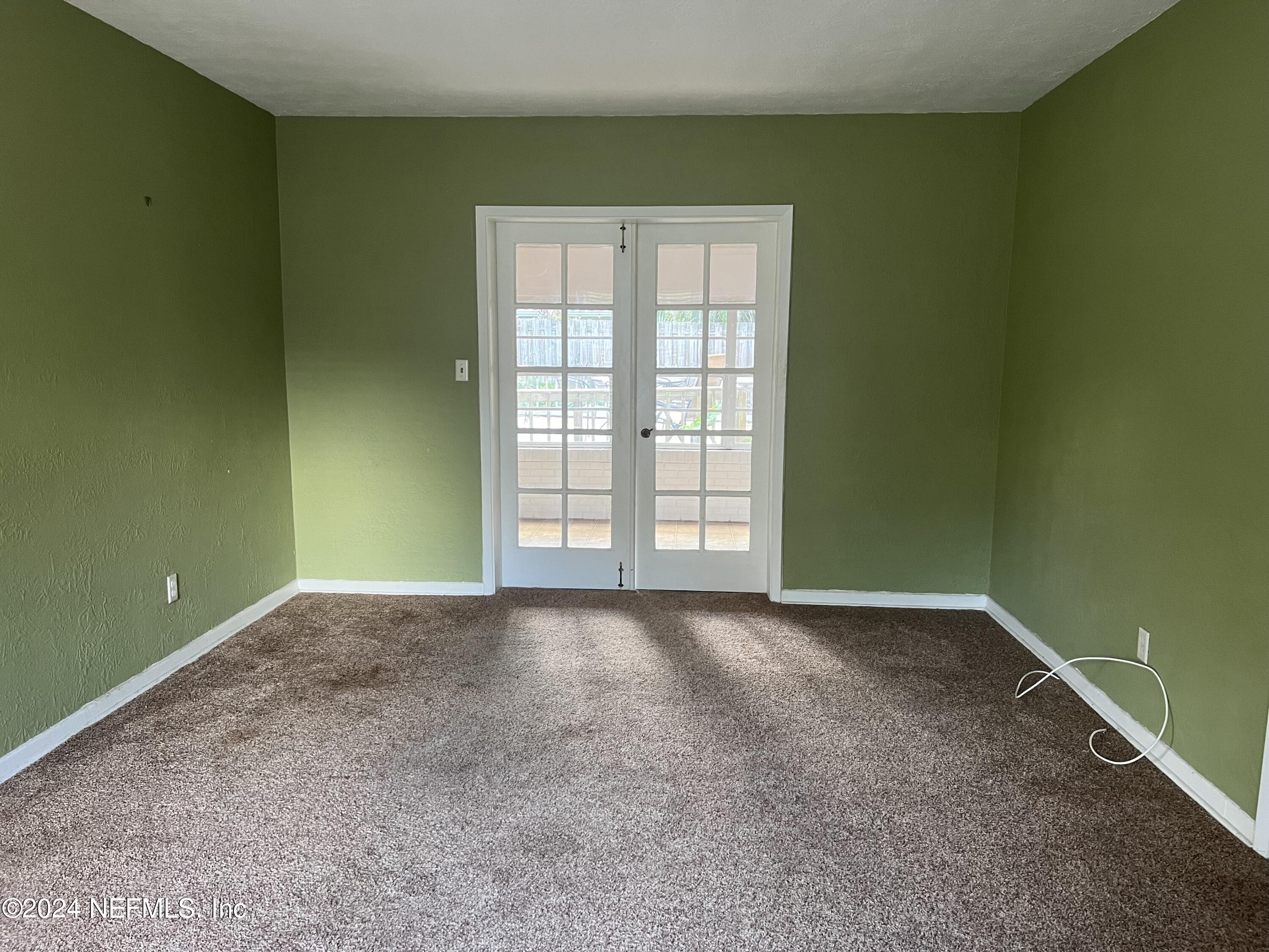 6115 Stetson Road Jacksonville, FL 32217 - Photo 7 of 25 a view of an empty room with a window