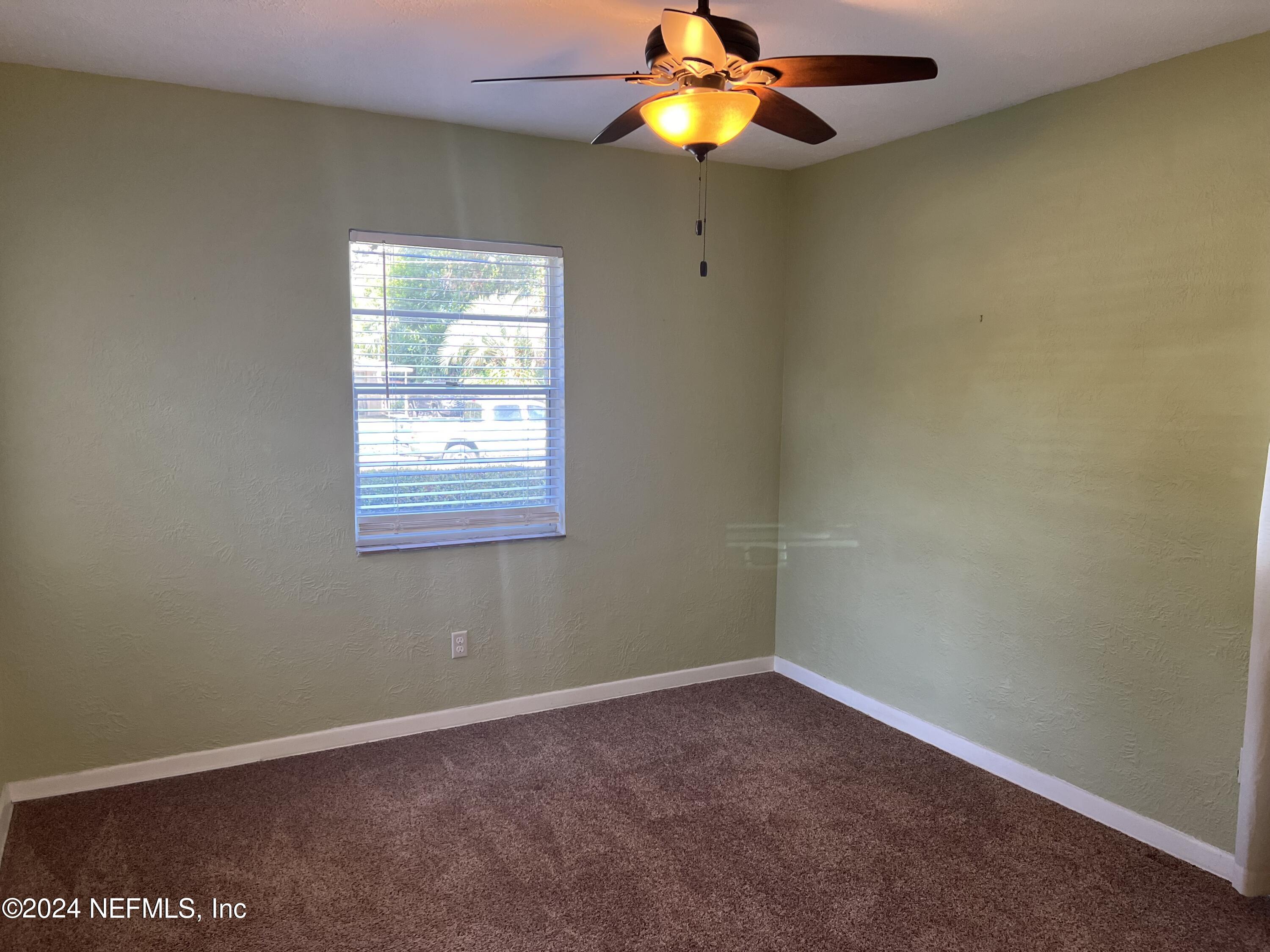 6115 Stetson Road Jacksonville, FL 32217 - Photo 9 of 25 an empty room with a window