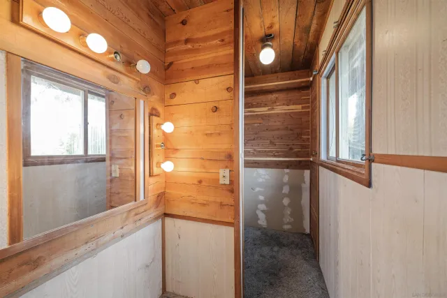 a kitchen with refrigerator and cabinets