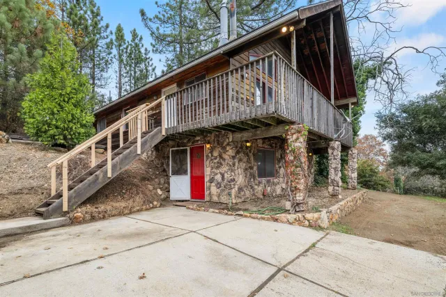 a bathroom with a glass shower door and a window