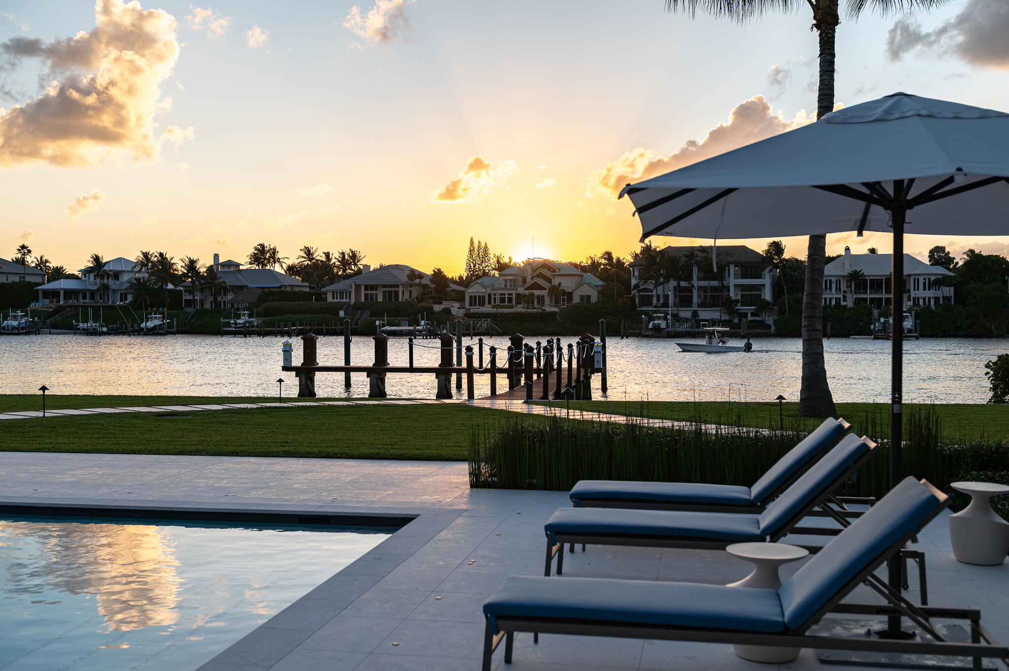 488 South Beach Road Jupiter Island, FL 33455 - Photo 44 of 54 a view of a terrace with chairs and lake view