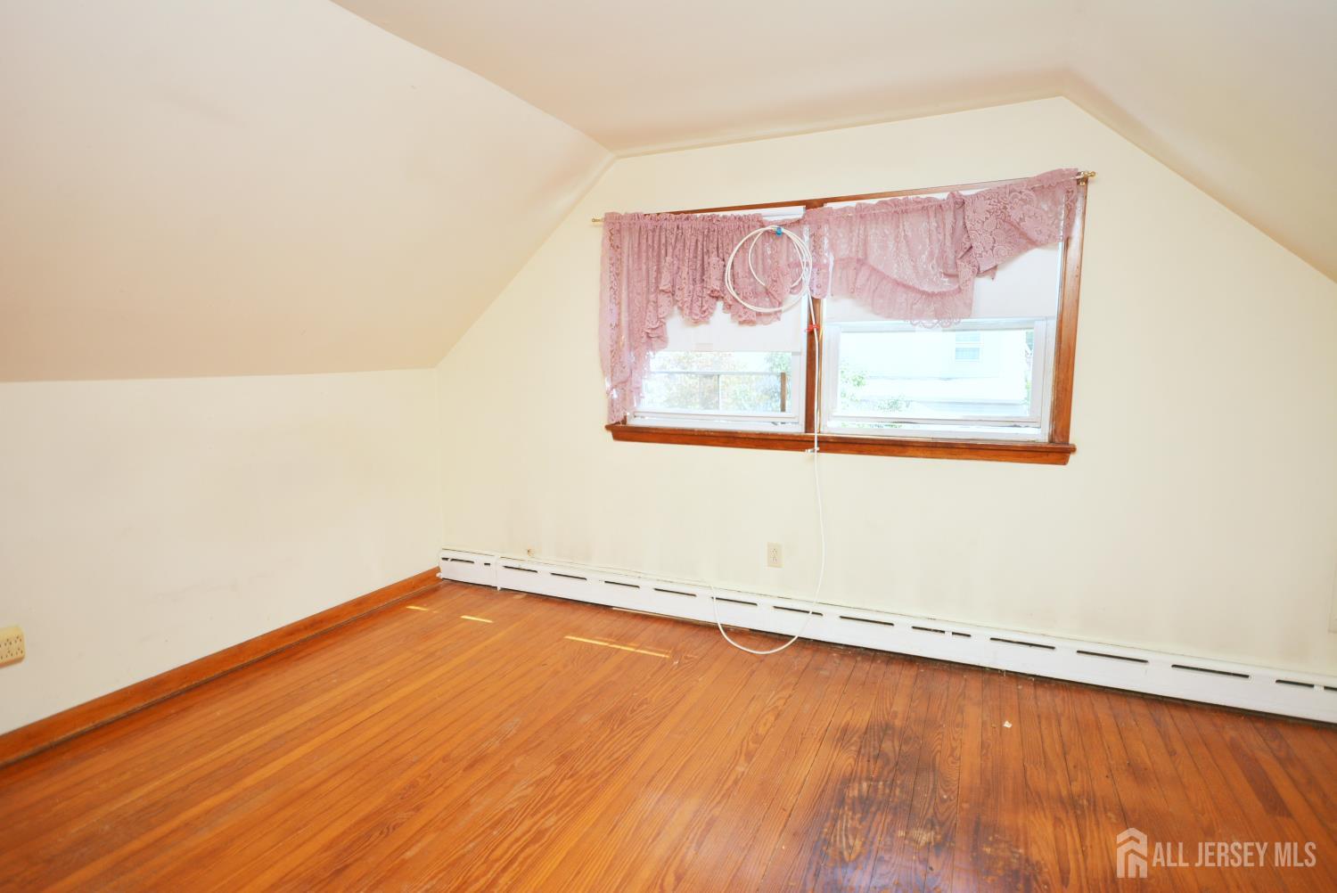 9 Emma Place Middlesex, NJ 08846 - Photo 25 of 32 a view of a room with wooden floor and window
