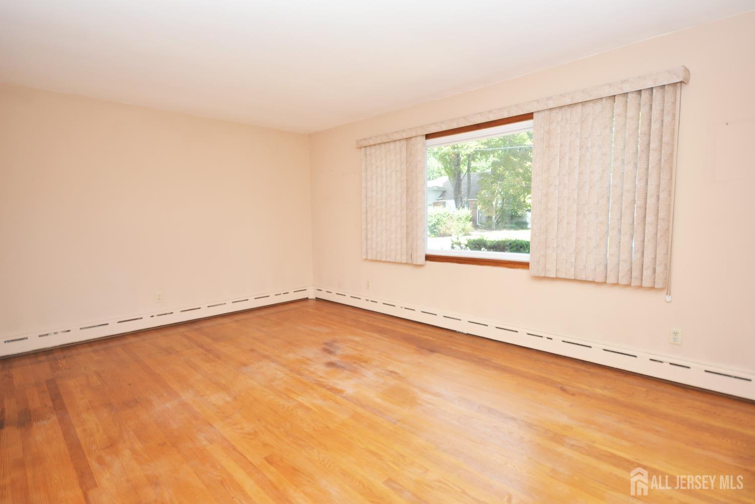 9 Emma Place Middlesex, NJ 08846 - Photo 3 of 32 a view of an empty room with a window