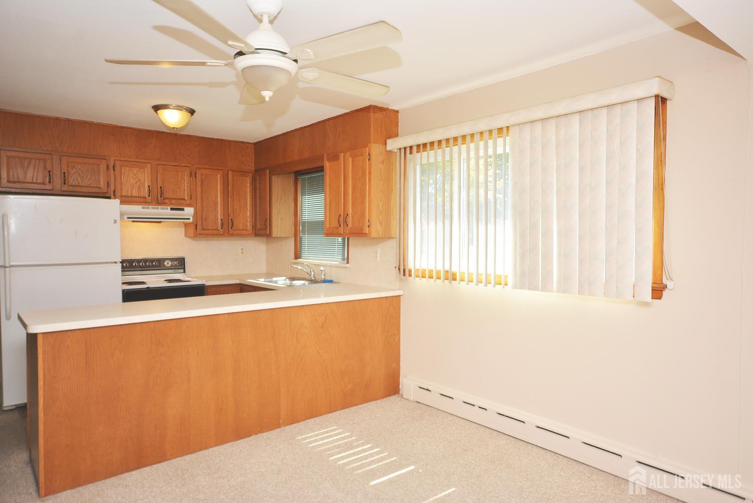 9 Emma Place Middlesex, NJ 08846 - Photo 8 of 32 a kitchen with stainless steel appliances granite countertop a refrigerator a sink and white countertops