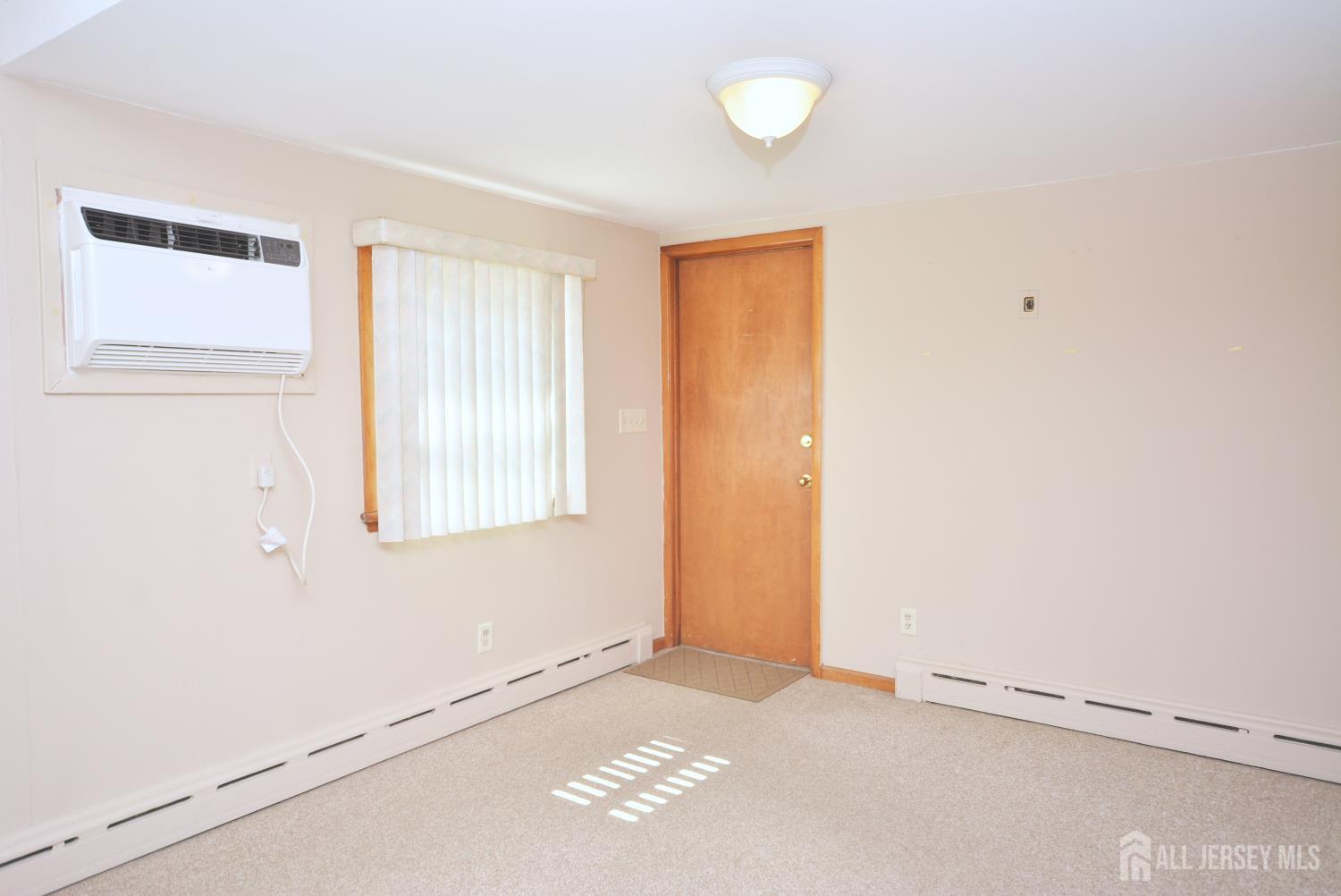 9 Emma Place Middlesex, NJ 08846 - Photo 9 of 32 a view of an empty room with a window