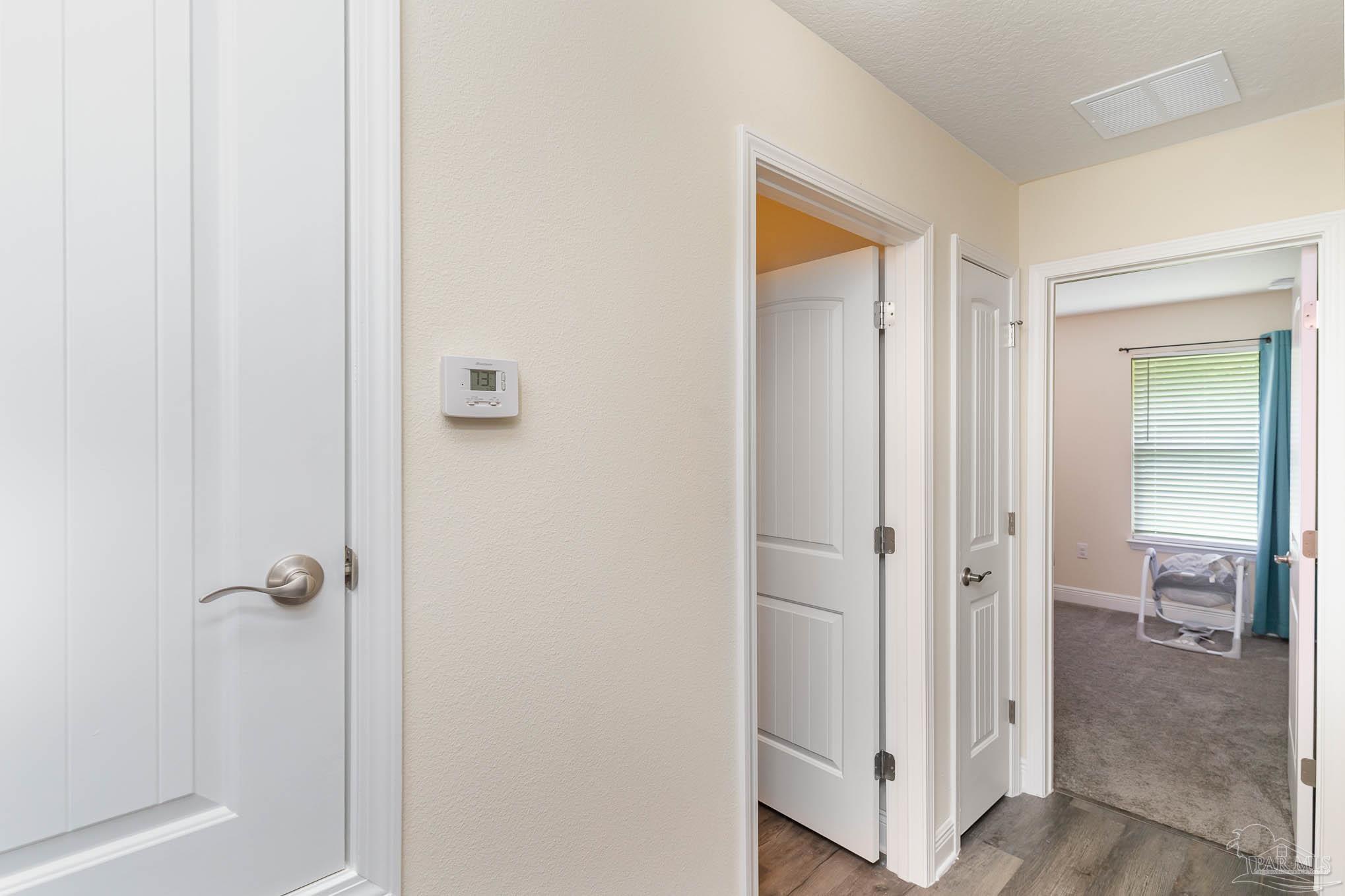 3315 Doyle Hawkins Road Navarre, FL 32566 - Photo 25 of 33 a view of a bathroom from a hallway