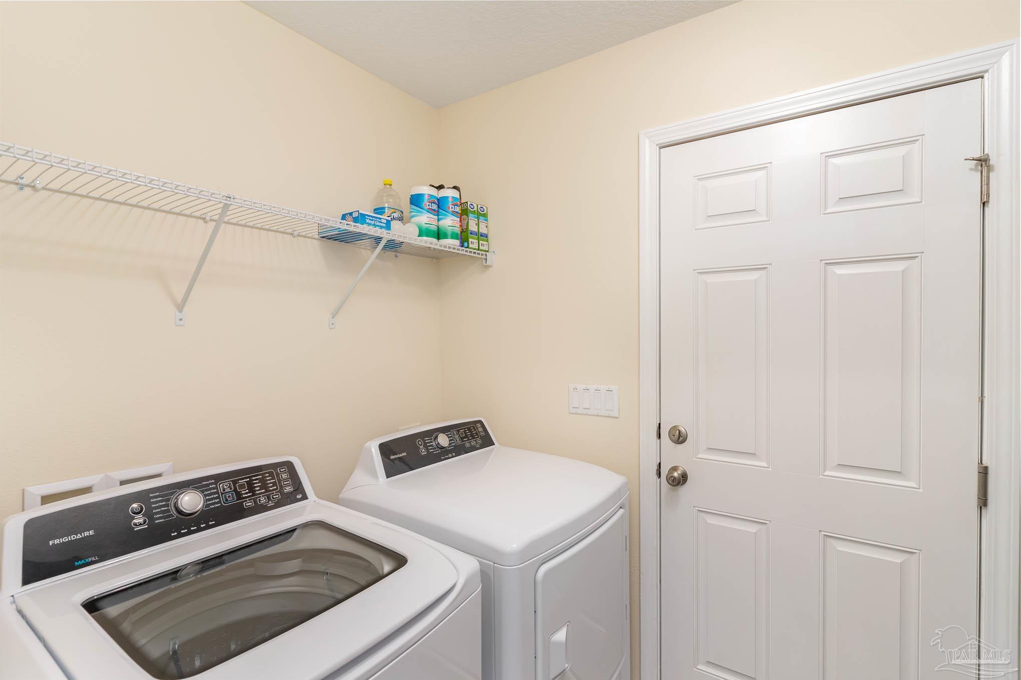3315 Doyle Hawkins Road Navarre, FL 32566 - Photo 27 of 33 a utility room with dryer and washer