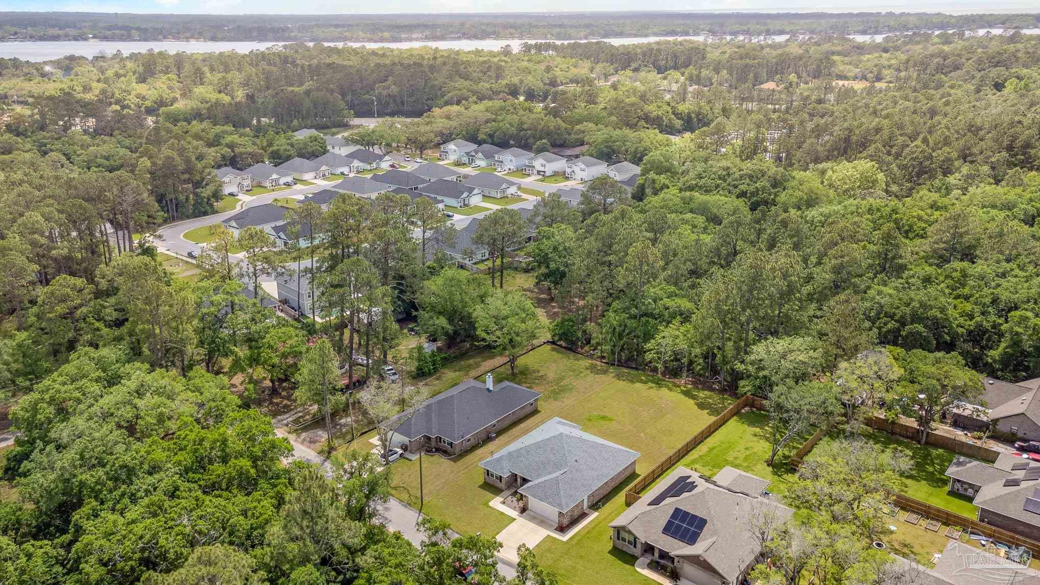 3315 Doyle Hawkins Road Navarre, FL 32566 - Photo 32 of 33 an aerial view of residential house with parking space