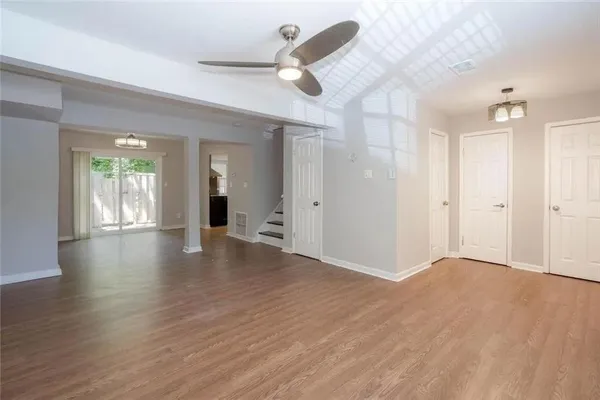 wooden floor in an empty room with a window