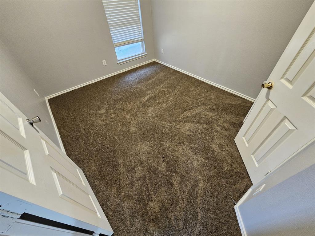 5886 Cliff Ridge Drive Dallas, TX 75249 - Photo 13 of 15 a view of a hallway with staircase