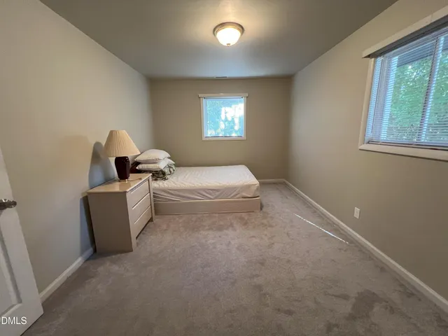 a room with bed and window