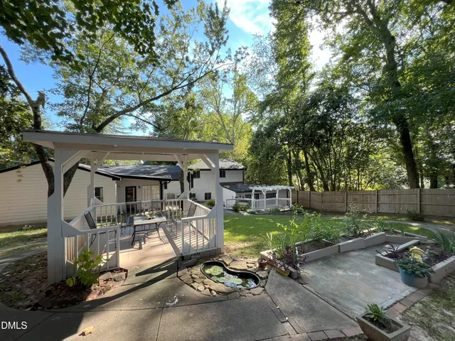 a view of yard from deck having patio